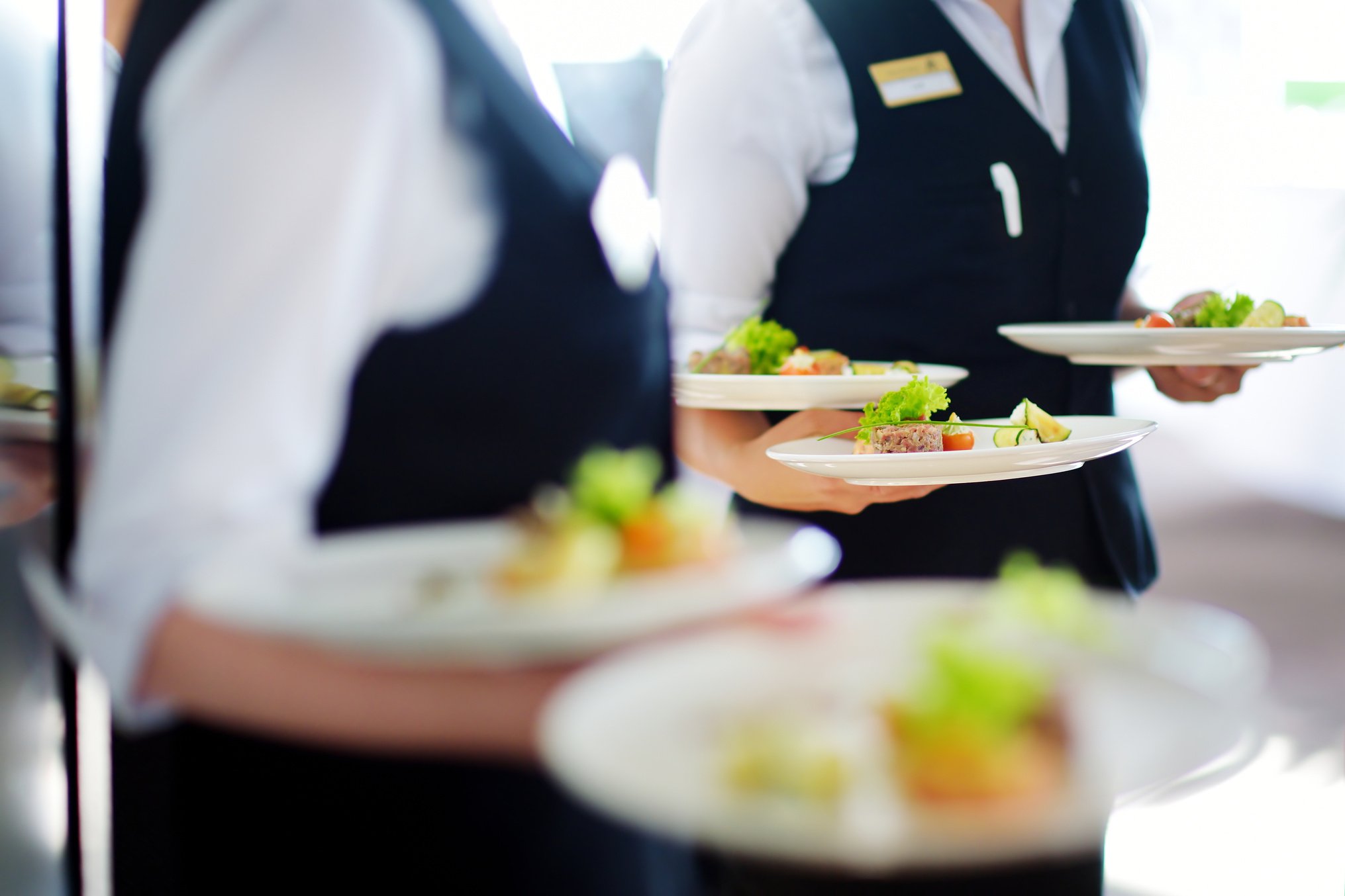 Waiter Carrying Plates